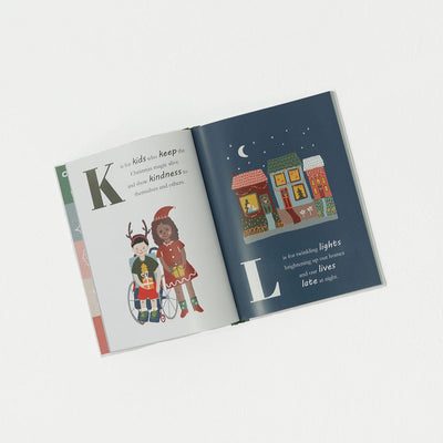 Open Christmas children's book with illustrations and text on a white background